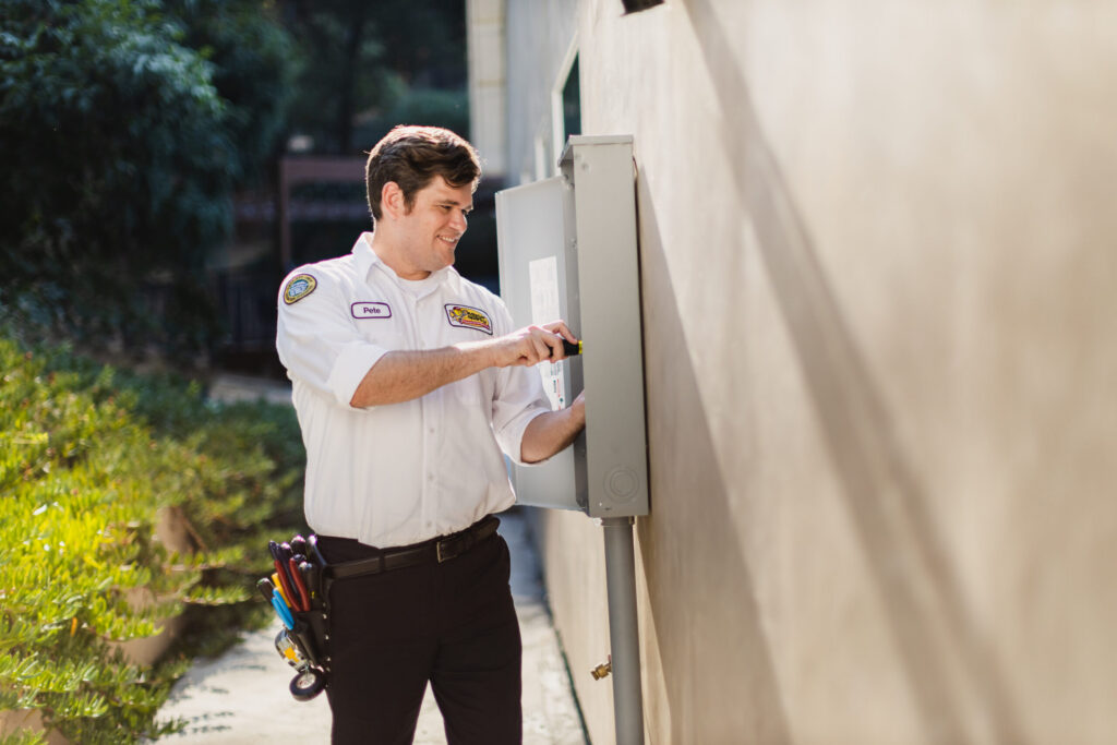 Male Tech Working on Electrical Panel