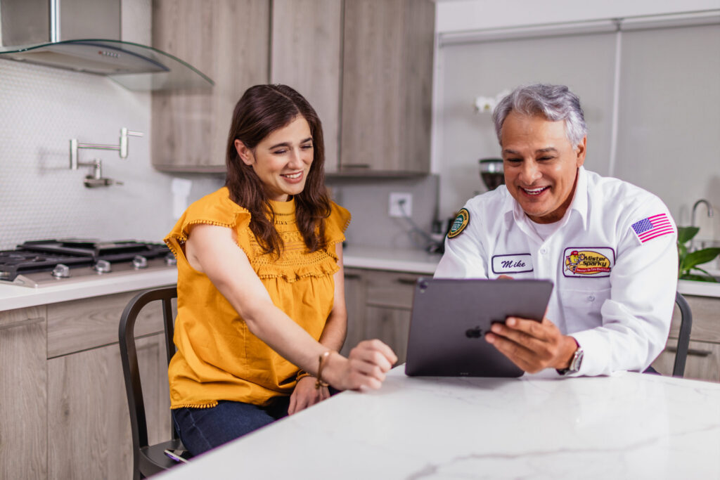 Tech & Homeowner looking at Tablet